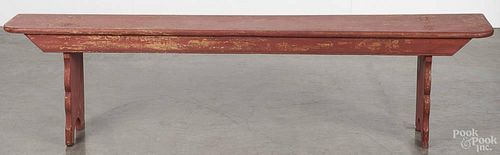 Pennsylvania painted pine mortised bench, 19th c., with scalloped legs, retaining an old red surface