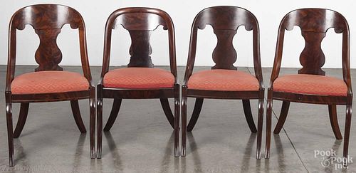 Set of eight Empire mahogany dining chairs, mid 19th c., with saber legs.