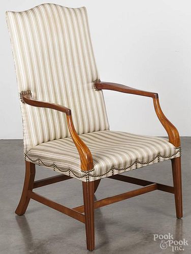 Georgian mahogany open armchair, 19th c., with molded legs.