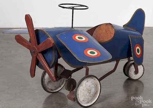 Pressed steel monoplane pedal car, ca. 1940, having removable wings, a leather seat