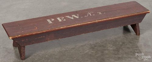 Painted pine kneeling bench, possibly Shaker, inscribed pew no. 2, on a red background