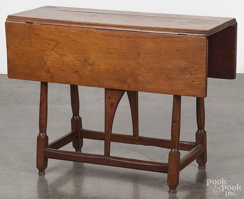 New England cherry butterfly table, late 18th c., the top and frame by association, 26 3/4'' h.