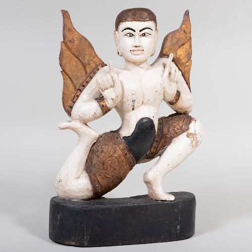South East Asian Painted and Parcel-Gilt Figure of a Winged Figure