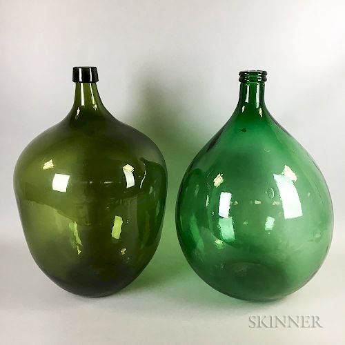 Two Green Glass Demijohns