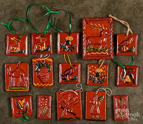 Fifteen Shooner redware Christmas ornaments.