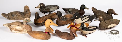 Thirteen carved and painted duck decoys