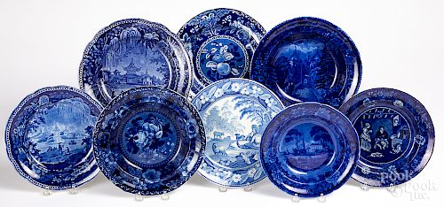Eight blue Staffordshire plates and shallow bowls