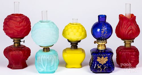 Five miniature glass lamps