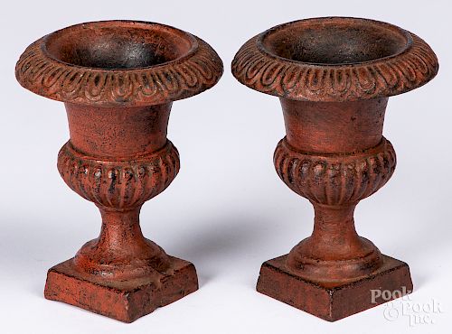 Pair of miniature painted cast iron urns
