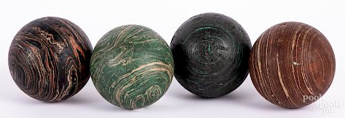 Four English painted lawn bowling balls