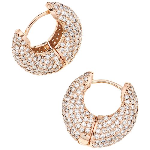 A diamond 14K rose gold pair of earrings.