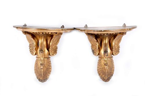 A pair of brackets and a sconce.