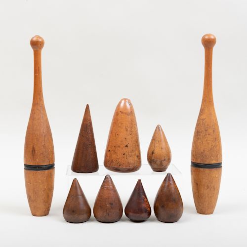 Group of Seven Wood Conical Turnpins and a Pair of Bowling Pins