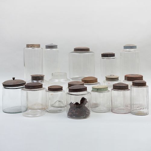 Group of Eighteen Glass Storage Jars with Seventeen Metal Covers
