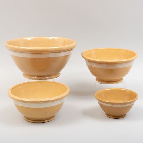 Group of Four Yellow Ware Pottery Bowls