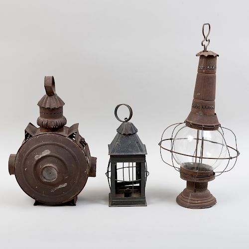 American Tin Railroad Signal Lantern, a Tin Candle Lantern, and a Smaller Lantern