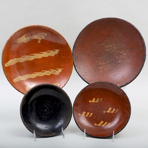 Group of Three American Slip Decorated Redware Plates and a Black Pottery Shallow Bowl