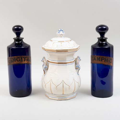Two Victorian Cobalt Glass Apothecary Jars and Stoppers and a Glazed Pottery Apothecary Jar and Cover 