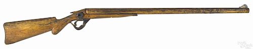 Large carved and painted pine double barrel shotgun trade sign, ca. 1900, 70'' l.
