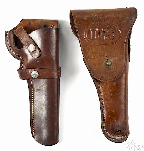 A 1911 holster, dated 1918, together with a modern Buchmeier revolver holster.