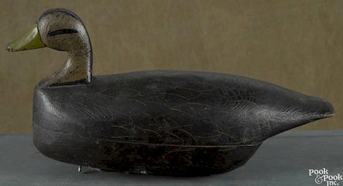 Carved and painted black duck decoy, mid 20th c., 16 1/4'' l.