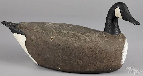 Carved and painted cork body Canada goose decoy, mid 20th c., 25'' l.