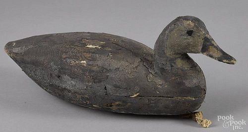 New Jersey carved and painted black duck decoy, mid 20th c., 16'' l.