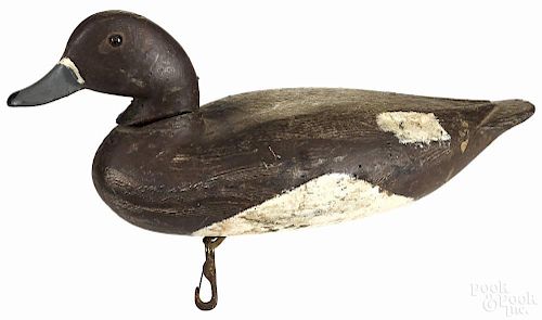 Carved and painted bluebill duck decoy, mid 20th c., with relief carved wings, 14'' l.