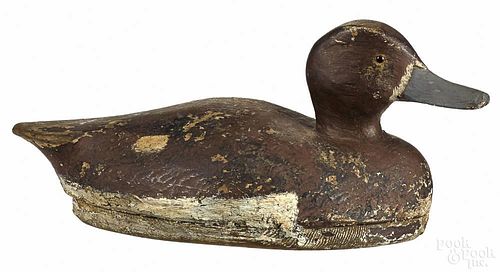 Two carved and painted bluebill duck decoys, mid 20th c., 14'' l. and 13'' l.