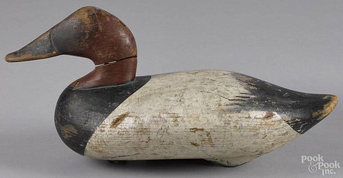 Carved and painted canvasback duck decoy, mid 20th c., attributed to R. Madison Mitchell, 15'' l.