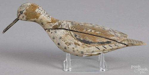 Carved and painted shorebird decoy, early/mid 20th c., with relief carved wings, 12'' l.