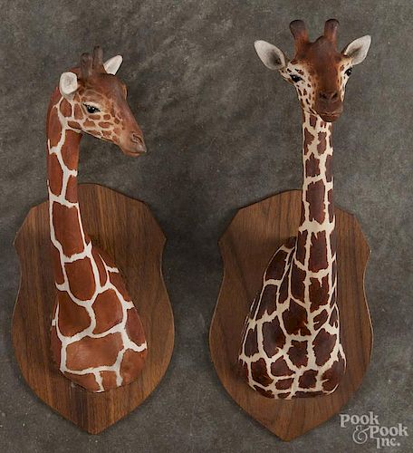 Two Louis Paul Jonas Studios composition sculptures of giraffe heads, both signed and dated 12/73