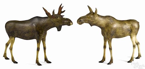 Pair of carved and painted bull and cow moose, ca. 1940, 13 1/4'' h., 16'' l.