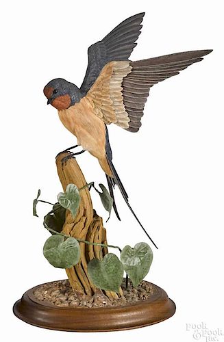 Fred M. Cutts, Reading, Pennsylvania, carved and painted barn swallow on a decorative base, signed