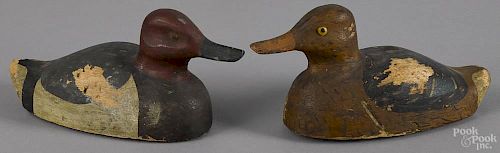 Pair of diminutive canvasback duck decoys, mid 20th c., with balsa bodies, 9'' l.