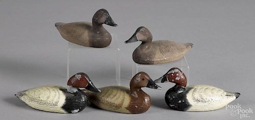 Two pairs of miniature cast lead canvasback duck decoys, two dated 1975, together with another