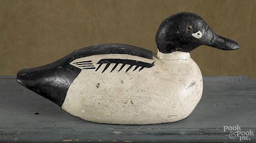 Carved and painted goldeneye duck decoy, mid 20th c., 14 1/2'' l.