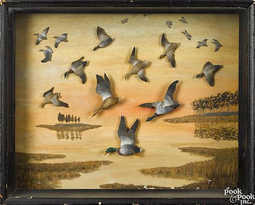 Diorama of flying mallards in a shadow box frame, bearing a label on verso