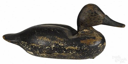 Two carved and painted bluebill duck decoys, mid 20th c., 13 3/4'' l. and 11 1/2'' l.