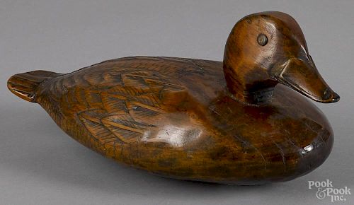 Carved and painted duck decoy, early 20th c., 14 1/2'' l., together with another duck decoy