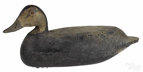 Two carved and painted black duck decoys, early 20th c., both - 15 1/2'' l.