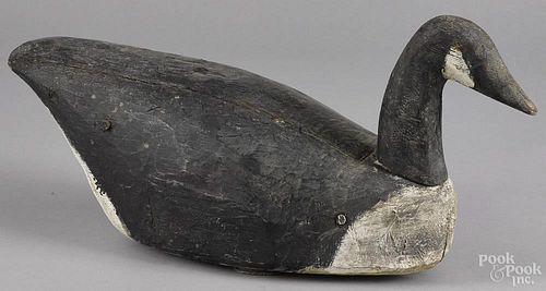 Carved and painted Canada goose decoy, early/mid 20th c., 24 1/2'' l.