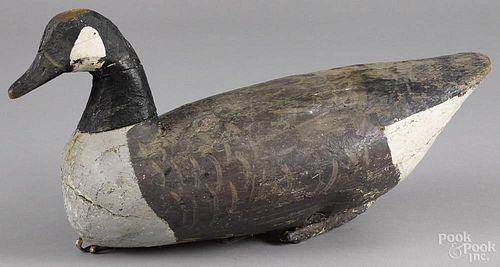 Carved and painted Canada goose decoy, early 20th c., 21'' l.