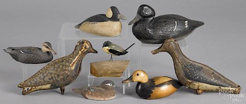 Group of contemporary miniature duck decoys, together with a carved songbird