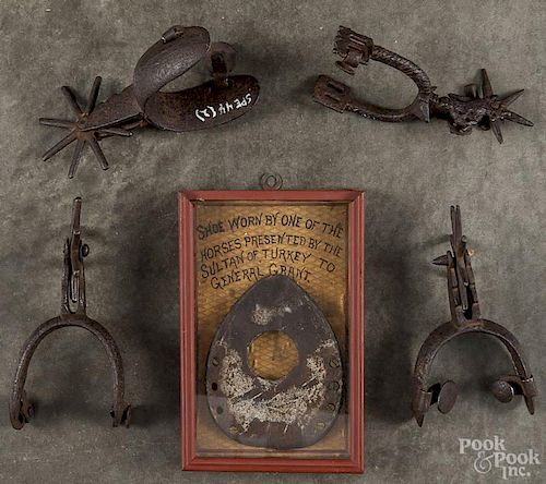 Pair of wrought iron spurs, 19th c., together with two single spurs and a cased horseshoe