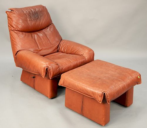 Modern maroon and leather club chair to include matching footstool. Estate from Sutton Place, NY. Name withheld by request