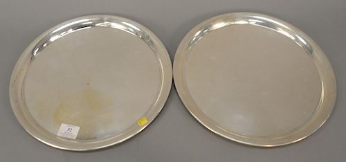 Pair of sterling silver round trays, dia. 13 3/8 in., troy ounces: 46.2. Provenance: An Estate from 5th Avenue, New York Provenance:...