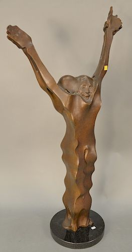 Large bronze sculpture of two figures with arms up on a granite base, signed illegibly.
