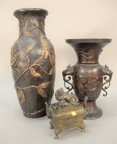 Three piece Chinese bronze censer mounted with lion (ht. 7 1/2 in.), and two bronze vases. ht. 15 1/2 in., 21 in.