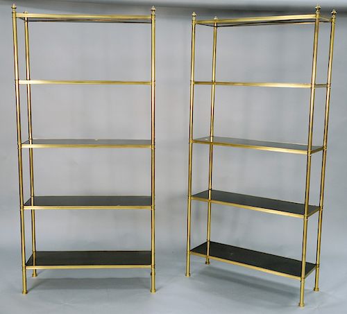 Pair of Maison Jansen modern brass etageres having five ebonized wood shelves. ht. 80 1/2 in., wd. 30 in., dp. 14 in. Provenance: An...